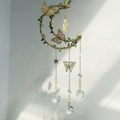 Detail of moon suncatcher with yellow crystal pendant, butterfly decor and rainbow prism - Citrine