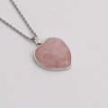Detail of pink heart crystal pendant with silver twisted chain and metal edging - Pink
