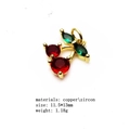 Macro view of gold cherry charm with red and green cubic zirconia for jewelry making - 14#