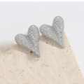 Macro detail of silver heart earrings with micro-paved white cubic zirconia crystals - Heart / Silver