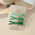 Three-piece set of matte green X-shaped hair clips for side bangs on display card - Green Gradient Cross Set