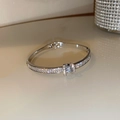 Macro shot of silver bangle featuring sparkling pavé crystals and a central diamond accent - Full Zircon Main Stone Silver (7# Bracelet-Silver)
