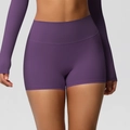 Detail of deep purple high-waisted seamless fitness shorts with butt-lifting feature - S / Dark Purple