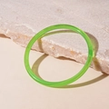 Macro detail of a translucent emerald green resin bangle on a textured stone surface - Green Thin Style (13#)