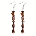 Macro shot of long drop earrings with irregular tiger eye stone beads on silver hooks - Tiger Eye Stone Bracelet