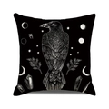 Detailed view of raven and mystical moon patterns on linen Halloween cushion cover - Raven and Occult Elements