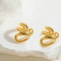 Abstract twisted golden ear cuffs with high polish finish on a minimalist stone base - Gold Fluid Curve Style