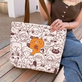 Canvas tote bag with cartoon orange cat print and brown handles in an outdoor setting - Sheep and Cat - Beige