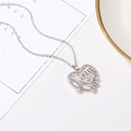 Macro shot of silver heart MOM pendant with sparkling diamonds on a delicate chain - Silver (0121)