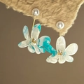 Macro view of blue and white resin flower earrings with pearl accent and small diamond center - Blue White Floral (27# Silver Post-Blue)
