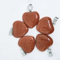 Five heart-shaped red sandstone pendants with silver metal bails on white background - Synthetic Gold Sandstone