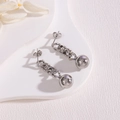 Silver long chain drop earrings with polished steel balls in a modern minimalist style - Silver