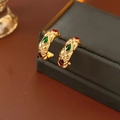 Macro shot of vintage gold C-shape hoop earrings with rhombus pattern and colorful gems - 925 Silver Needle / Matelassé Inlaid Style / Gold