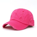Detail view of pink distressed cotton baseball cap showing frayed edges and vintage texture - Rose Red