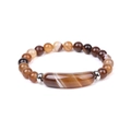 Macro view of agate gemstone bracelet with striped beads and silver metal spacers - Striped Coffee Agate