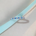 Close-up of S925 silver ring with blue and white zircons on a light blue silk ribbon - Size 5 (US 5) / Light Blue Zirconia