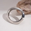 Detailed close-up of a silver polished geometric bangle with hinge and clasp on wood - 7# Bangle-Silver