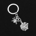 Macro detail of silver metal spider and spiderweb pendants on Halloween keychain - Spider and Web Style (2#)