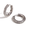 Silver finish huggie earrings with multi-row pavé white zircon stones on white background - Round Half-inlaid Zircon / Steel