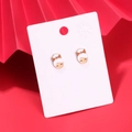 Fashionable gold-plated cartoon girl stud earrings with orange glitter bow detail - Mrs. Claus