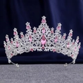 Macro shot of silver bridal crown featuring pink teardrop crystals on navy background - Silver Pink Crystal