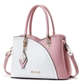 Pink and white contrast leather handbag with gold hardware and butterfly pendant detail - Pink with White