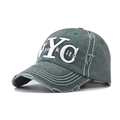 Detailed macro view of vintage NYC embroidery and distressed edges on washed cotton cap - Adjustable / NYC Dark Green