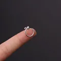 20g stainless steel cartilage stud with cubic zirconia in a C-shape on a fingertip - C-Type Diamond Row Ball Head (HSPJ356-14#)