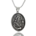 Detail view of St. Barbara relief on silver stainless steel oval pendant necklace - St. Barbara