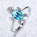 Silver turtle ring with a vibrant blue oval gemstone and sparkling crystal accents - Aqua Blue Zirconia