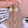 Luxury gold tassel earrings featuring white opals and shimmering rhinestone accents - Gemstone Long Tassel / Gold