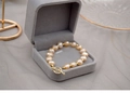 Detail of a golden freshwater pearl bracelet with T-bar clasp in a grey velvet jewelry box - 15-16cm (Wrist Circumference) / Toggle Clasp Style / Pink