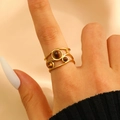 Detailed view of a gold open ring with tiger eye stones worn on a finger - 镂空多层三主石款式(4306) / 18K Gold