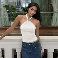 Close-up of a white halter neck top featuring a decorative golden metal buckle detail - S / White