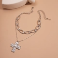 Detail of silver-tone double-layered necklace with metal links and pearl cross pendant - Two-Piece Set / Silver