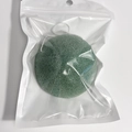 Green round biodegradable konjac facial sponge with hanging string in clear bag - Green Hemispherical
