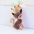 Golden fox keychain with dark rhinestones and red crown detail on a metal base - Black