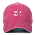 Detailed view of white DOG DAD embroidery on a vintage pink washed cotton baseball cap - One Size / Rose Red