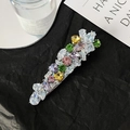 Bow hair clip with colorful cubic zirconia and silver finish on textured dark background - 3158-Long Strip Colored Zircon