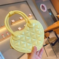Detail of yellow heart-shaped PVC jelly bag featuring a classic quilted lattice pattern - 17*5.5*11cm / Yellow