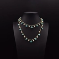 Double-layered gold necklace featuring natural pearls and turquoise on a black bust - Turquoise & Artificial Pearl Necklace