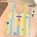 Foldable striped shopping bag with blue and yellow star patterns and cartoon cat design - Blue Yellow Cat