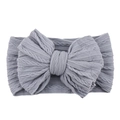 Grey nylon stretchy infant headband with a large textured cable knit bow hair accessory - Light Gray