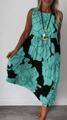 Detail of mint green and black floral print on a sleeveless tiered maxi dress - S / Bottoms / Green