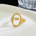 Macro shot of gold-plated titanium ring featuring irregular hammer texture finish - 06 Gold G-122