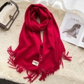 Solid red cashmere-feel scarf with fringe hem detail on a stylish minimalist background - Wine Red