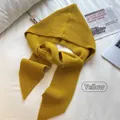 Detail of chunky knit yellow hooded scarf with vertical ribbed texture on white bedding - Hat and Shawl Integrated Set / Yellow
