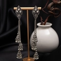 Macro detail of vintage silver triple-layered Jhumka earrings with tassels and rhinestones - H4183 Antique Silver
