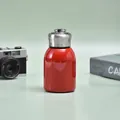 Mini 304 stainless steel insulated bottle in glossy red finish with silver metal ring cap - 300ml (316 Base) / Red