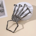 Punk skeleton hand bone bracelet with adjustable rings in gunmetal finish on white stand - Gunmetal